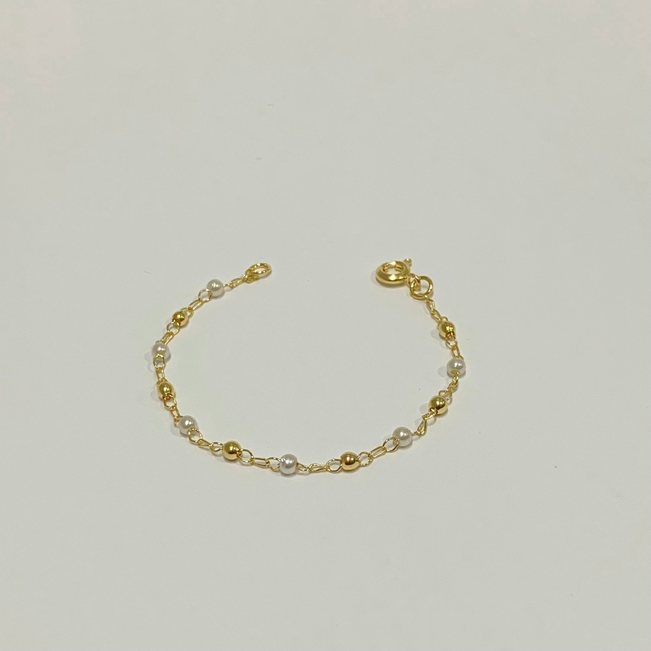 Pulseira bolinhas e perolas infantil folheado a ouro 18K
