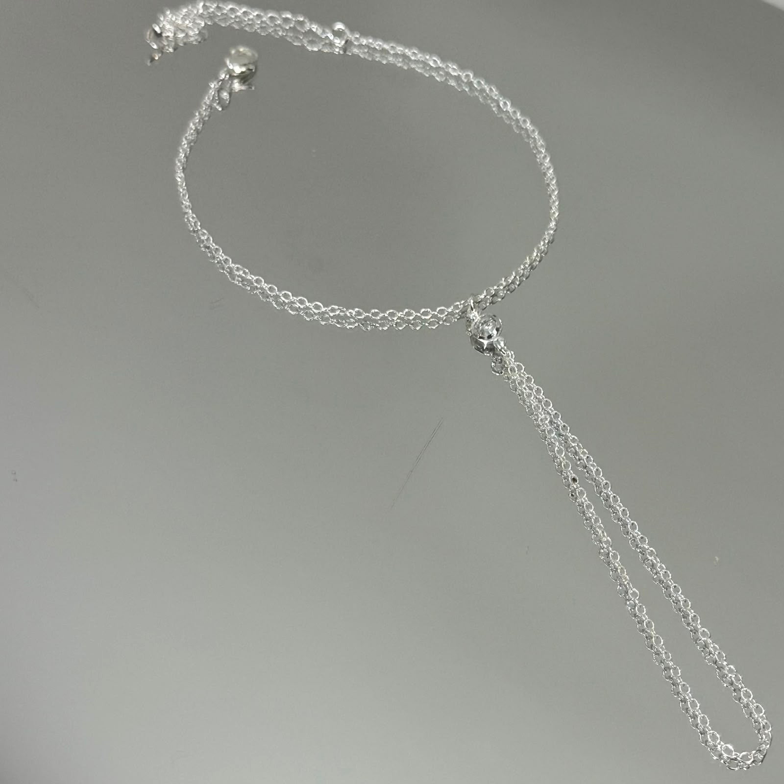 Pulseira Hand Chain folheada a prata