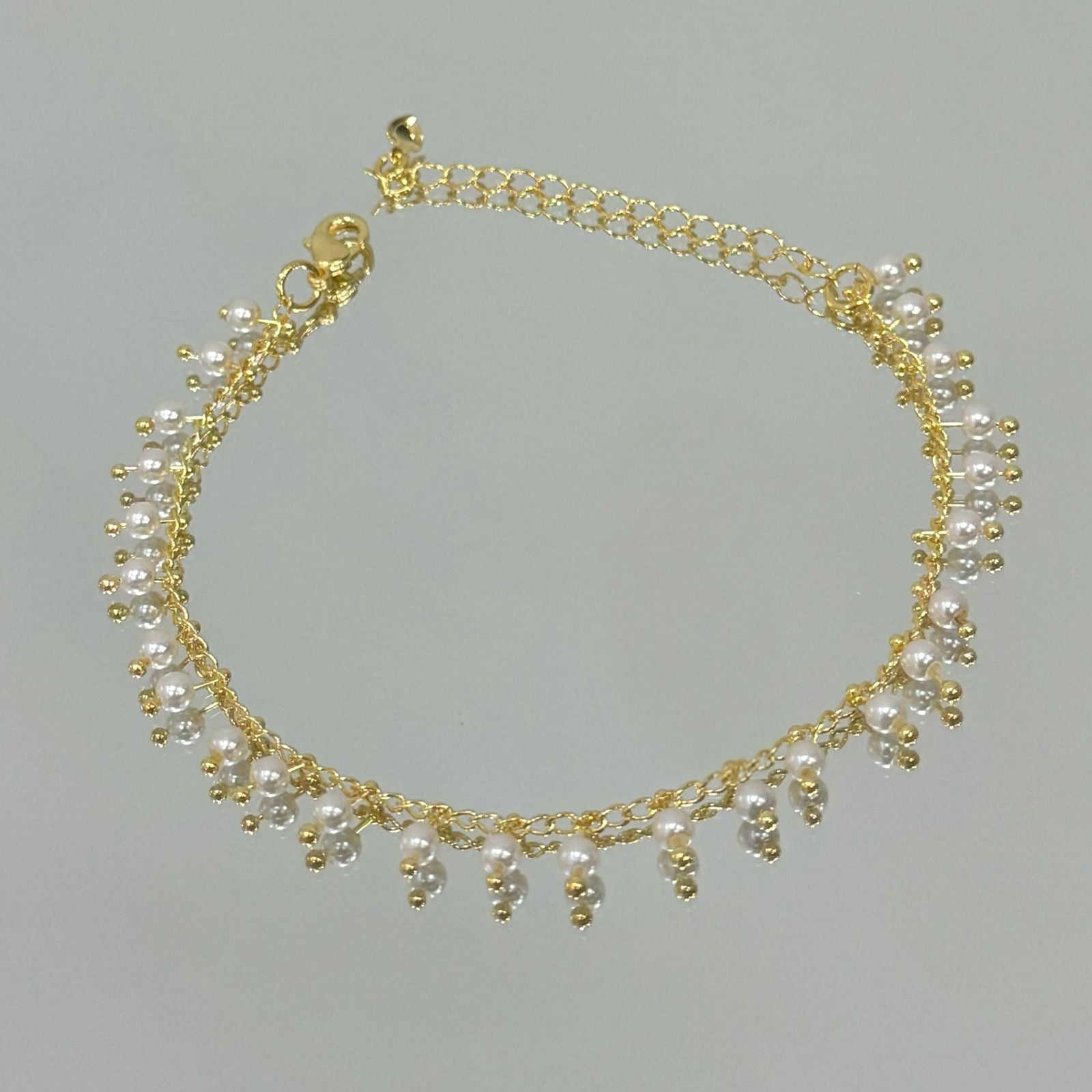 Pulseira Mini Pérolas cheia folheada a ouro 18K