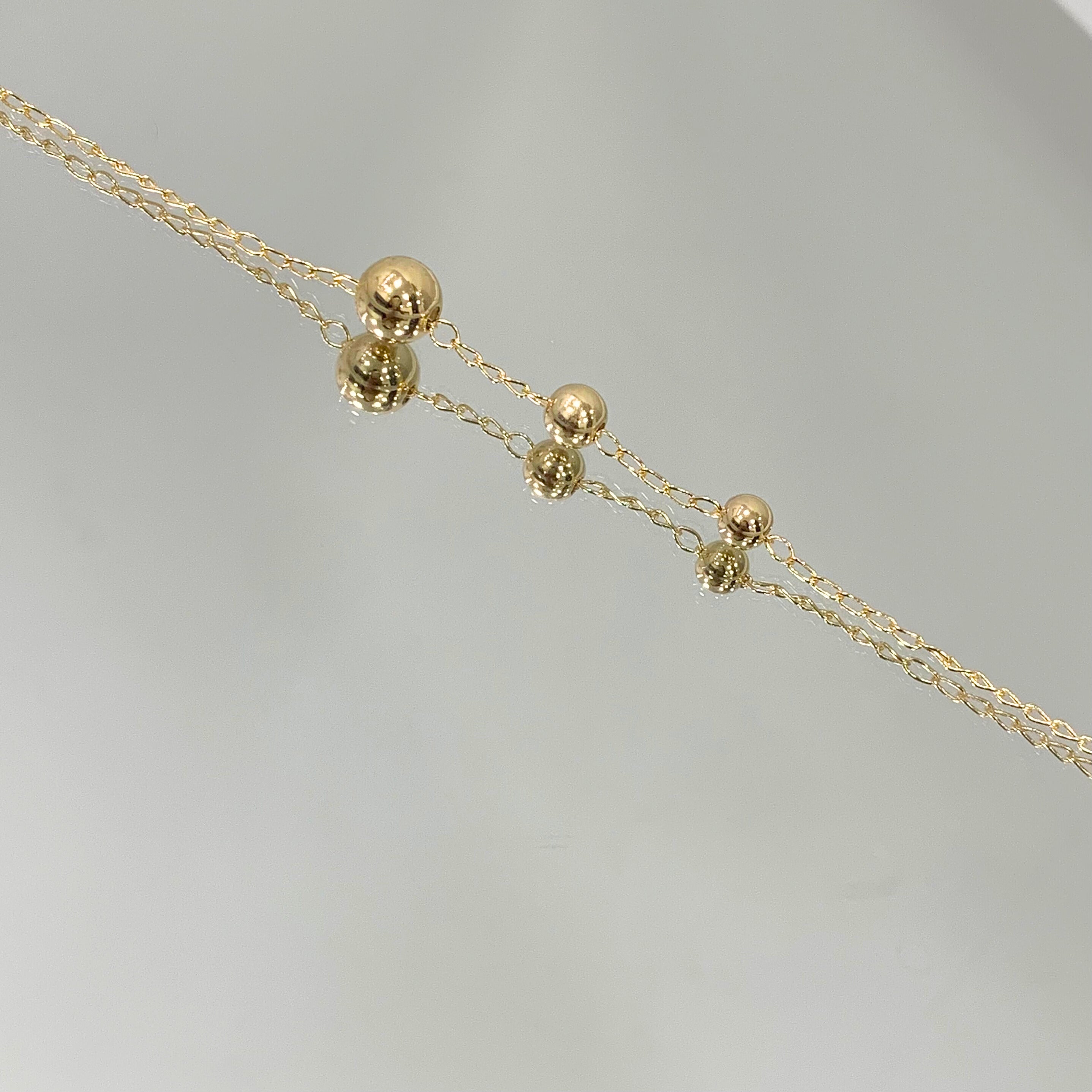 Pulseira 3 bolas folheada a ouro 18k