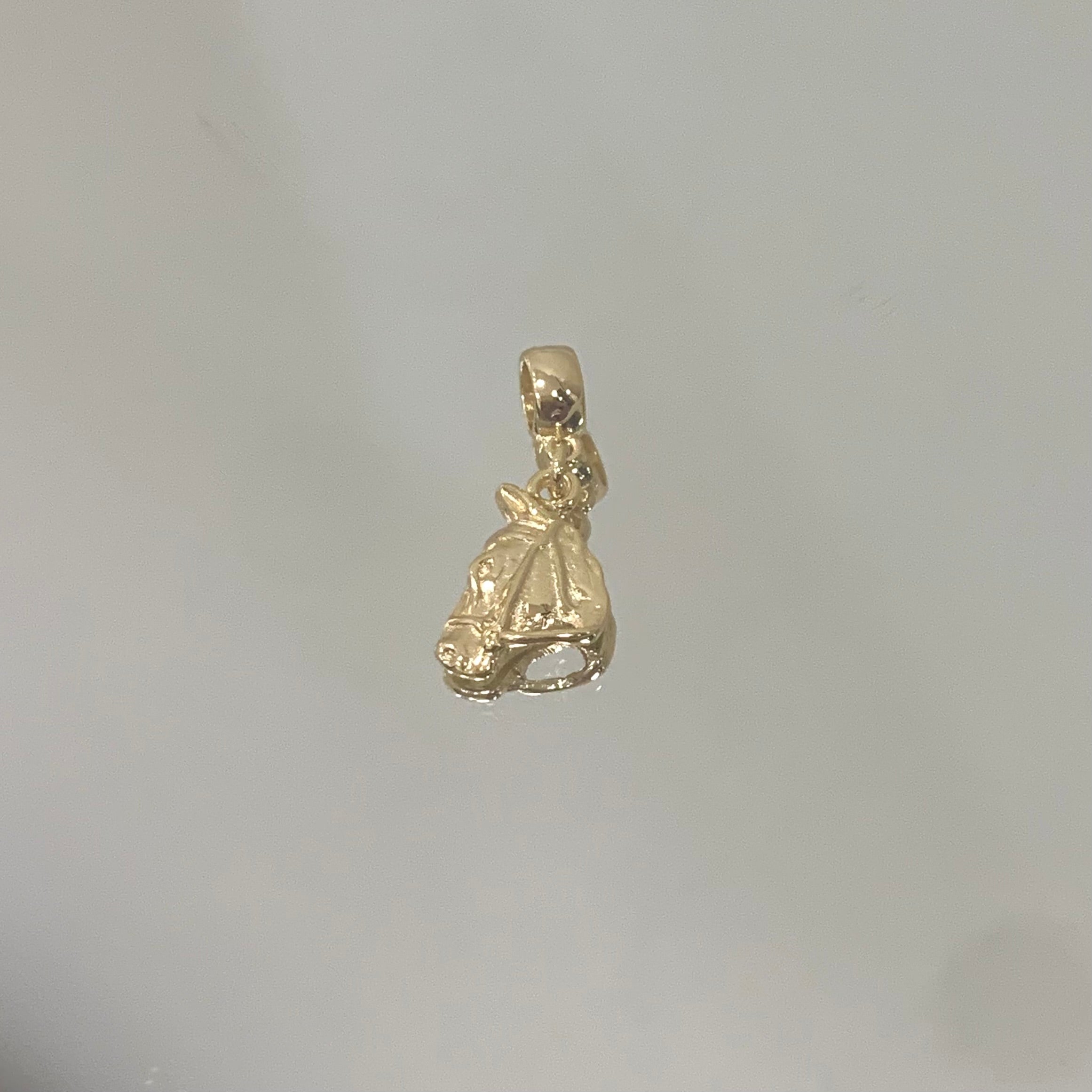 Berloque Horse JN folheado a ouro 18K