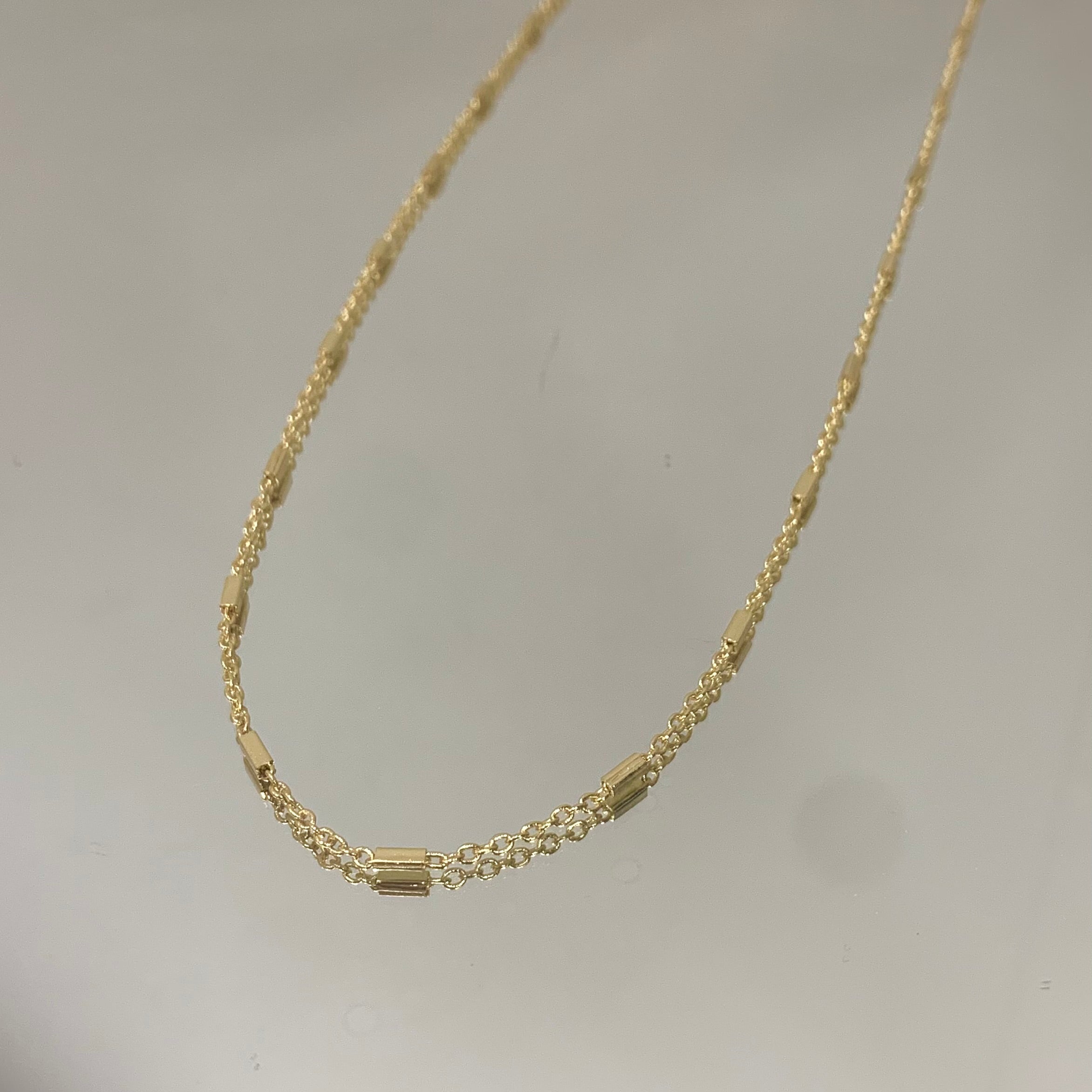 Colar Longo Tracinhos folheado a ouro 18K