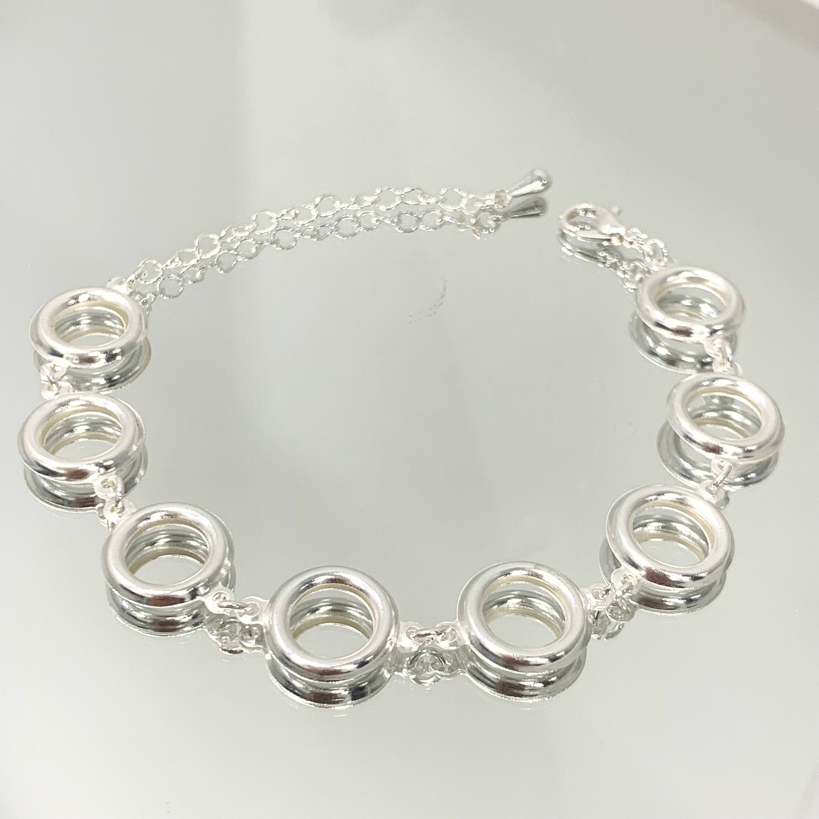 Pulseira Argolas em elos folheada a prata