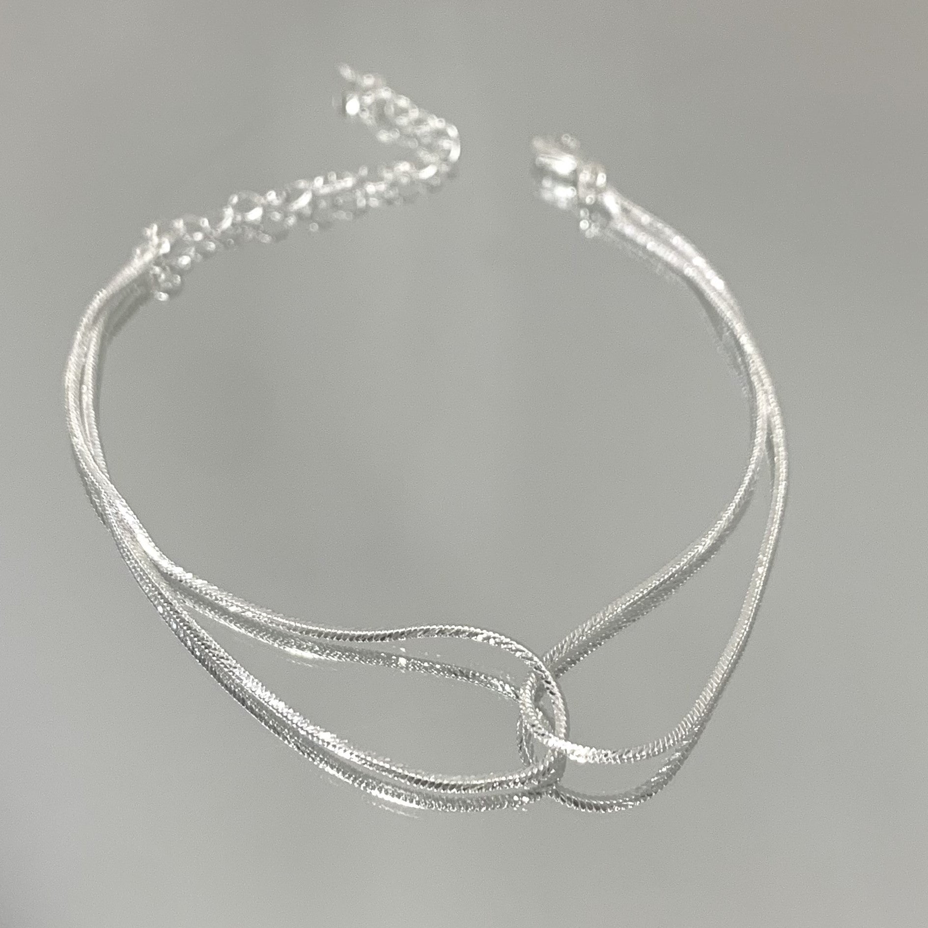 Pulseira Entrelaçada folheada a prata