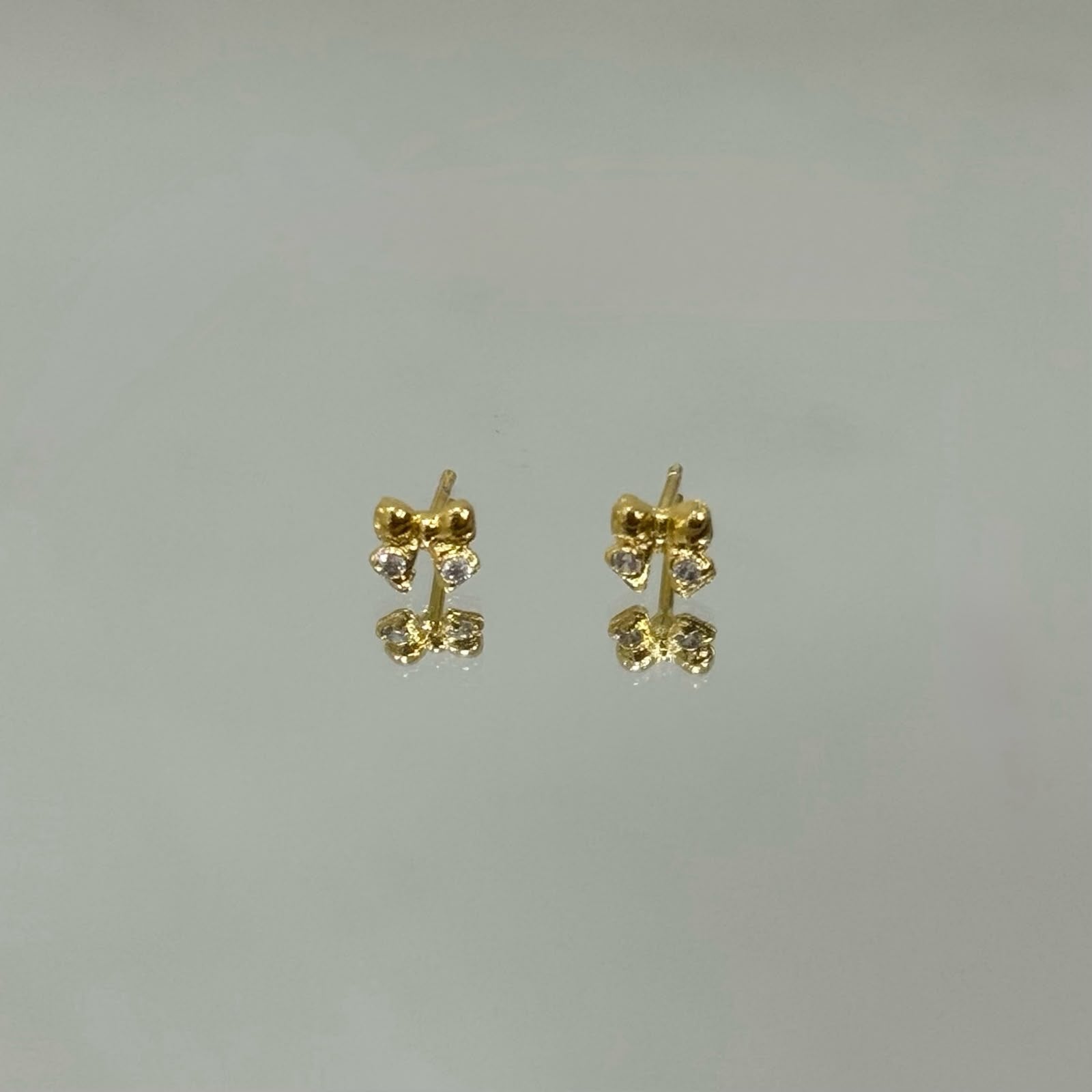 Brinco Lacinho tx baby folheado a ouro 18K